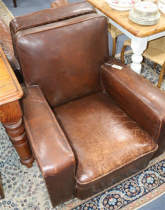 A pair of French leather club armchairs